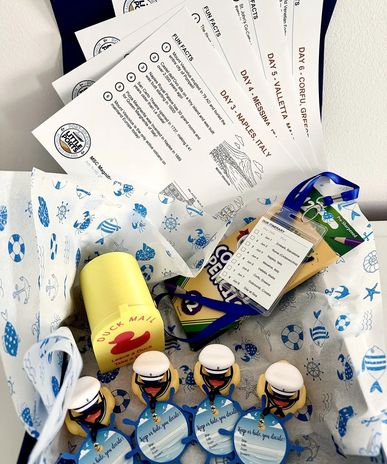 Open Little Ports box with port cards, lanyard, colored pencils, Duck Mail mailbox and sailor ducks
